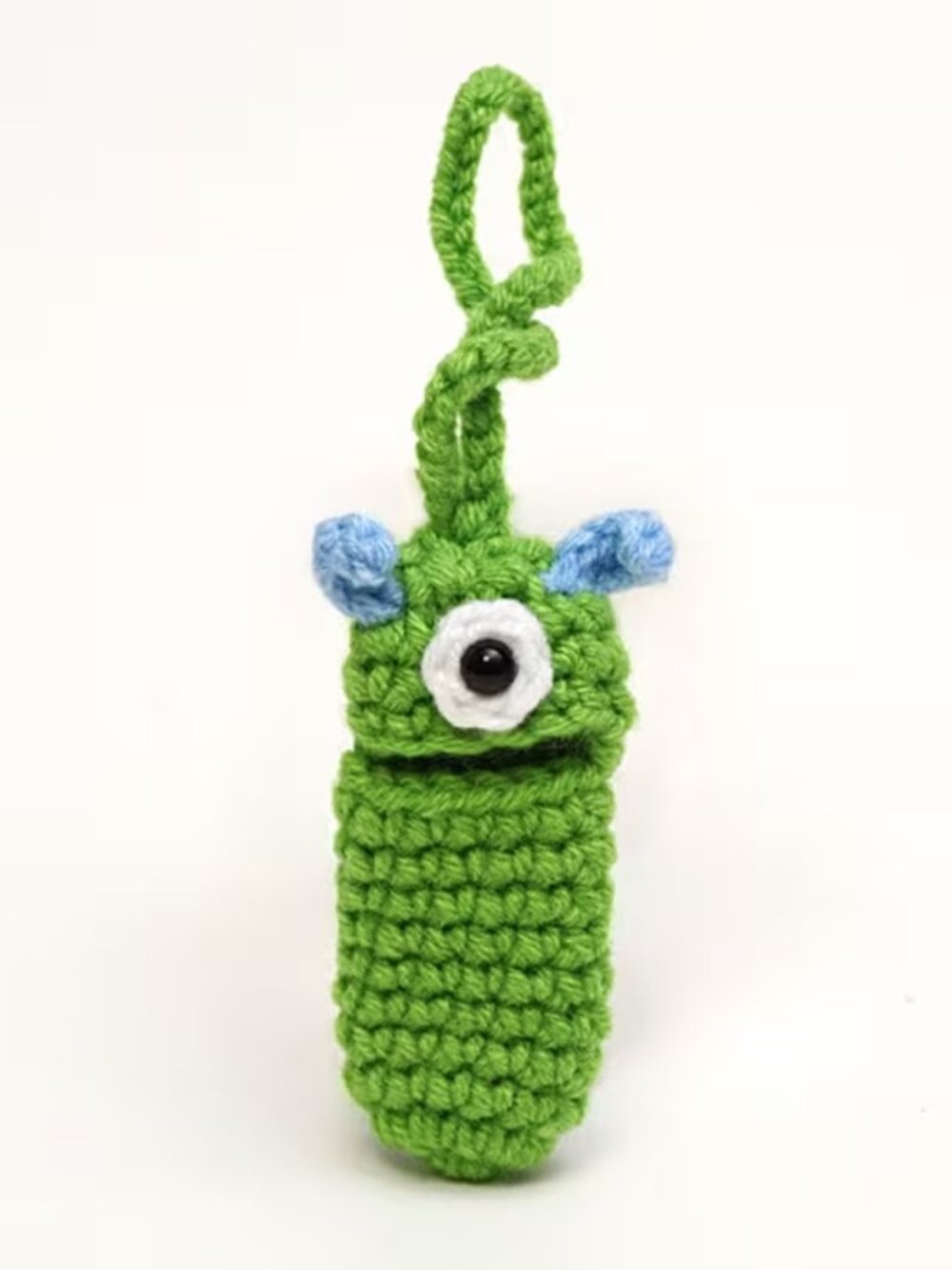 Crocheted cartoon one-eyed monster small item storage pendant.